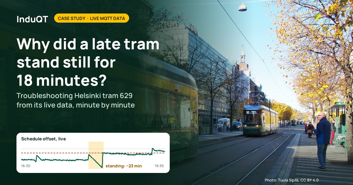 Helsinki trams on Mannerheimintie in autumn, one approaching a stop where people wait
